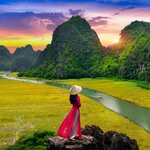Float down the Tam Coc River in Ninh Binh province