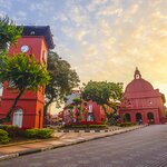 Hire a flower-decorated trishaw and tour historic Melaka
