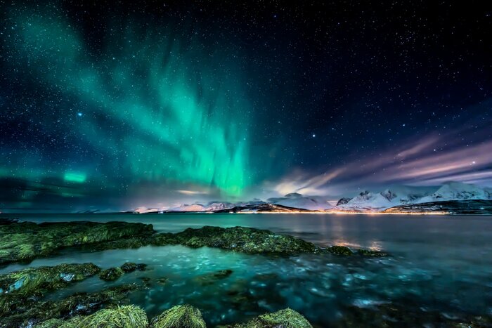 View of the northern lights from the Oldervik coast, near Tromsø