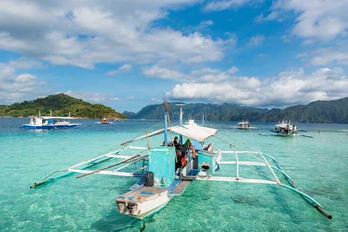 Explore Coron's coast and craggy islands by outrigger