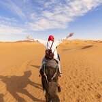 Ride camels and spend the night in a Bedouin camp in Morocco's desert