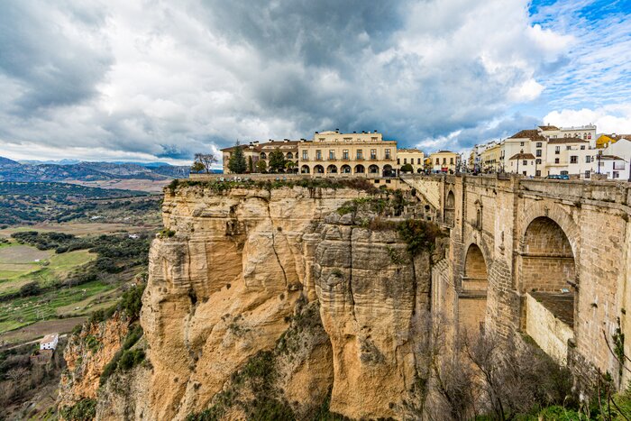 Visit the white village of Ronda and cross all three bridges, including the Puente Nuevo