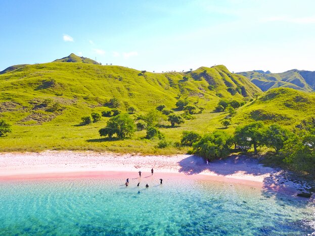 Boat around the pink beaches and islands of Flores during this 13-day tour