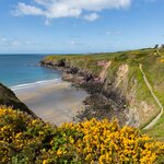 Hike Wales' Pembrokeshire Coast path for stunning views over Caerfai Bay