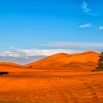 Spend two nights under desert skies in a luxury camp near Merzouga