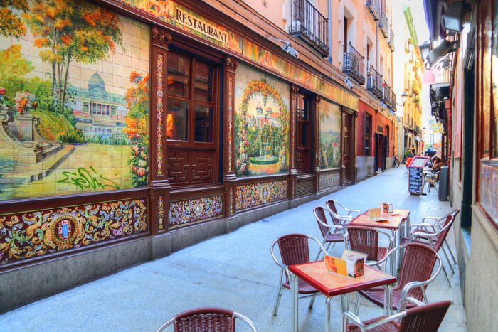 Explore Madrid's cultural highlights and dine on tapas in taverns in a historic part of Madrid