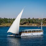 Spend four days sailing along the Nile River aboard a dahabiya (traditional sailboat)