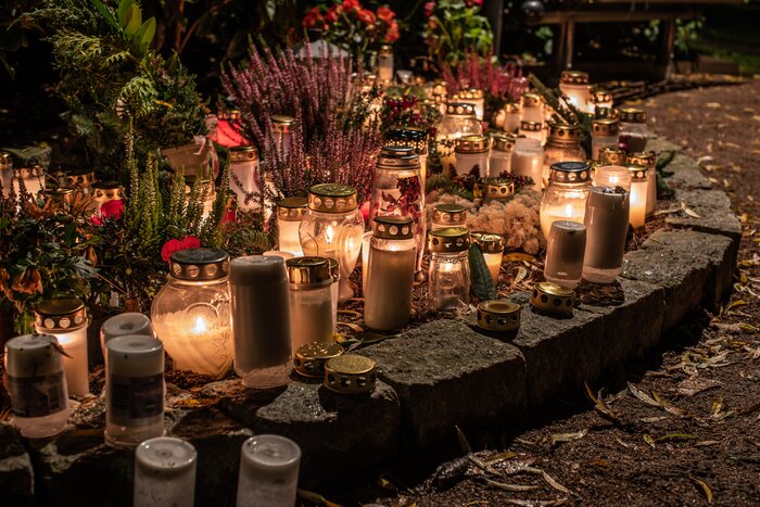 All Saints Day grave candles cast a pretty glow