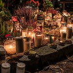 All Saints Day grave candles cast a pretty glow