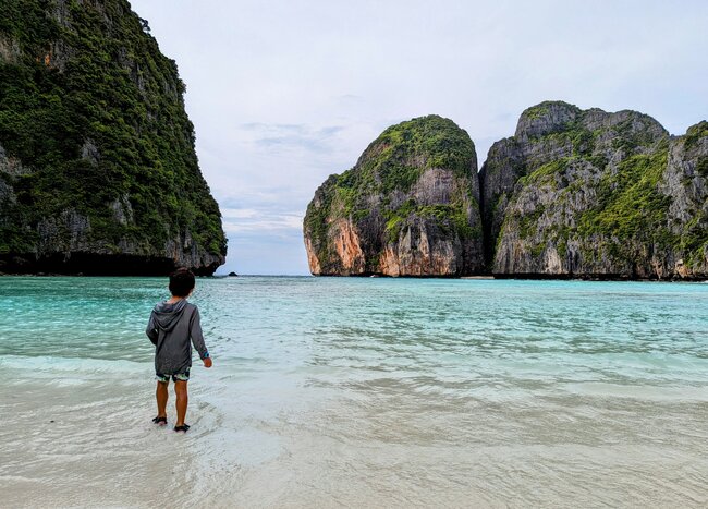 A child enjoys the view of Maya Bay in the Phi Phi Islands