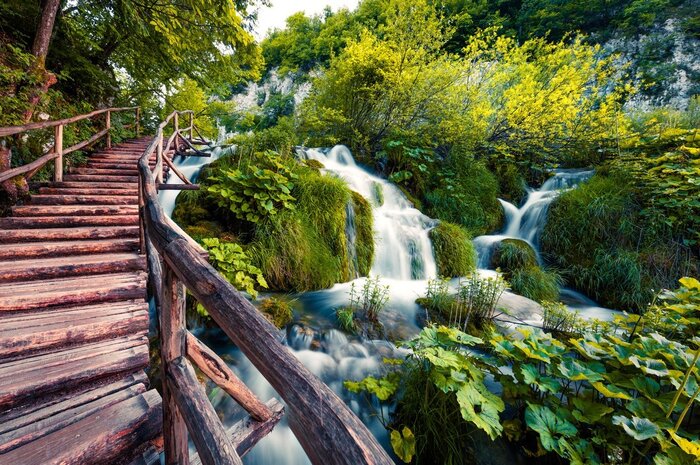 Follow boardwalks and trails through the lakes and waterfalls of Plitvice Lakes National Park