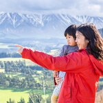 Mother and child looking at mountains in New Zealand