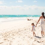 Walk along the white sand beaches and turquoise waters of Tulum