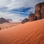 Camp overnight in the red-sand desert of Wadi Rum