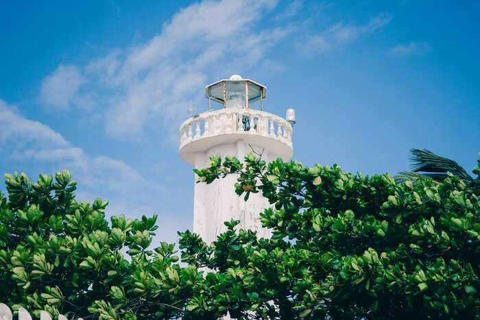 A lighthouse keeps watch over the rich biodiversity and coral gardens off the shores of Puerto Morelos