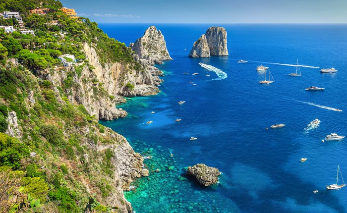 Enjoy a day trip to stunning Capri, and check out the beach and Faraglioni cliffs