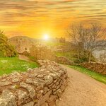 Urquhart Castle at sunset beside Loch Ness