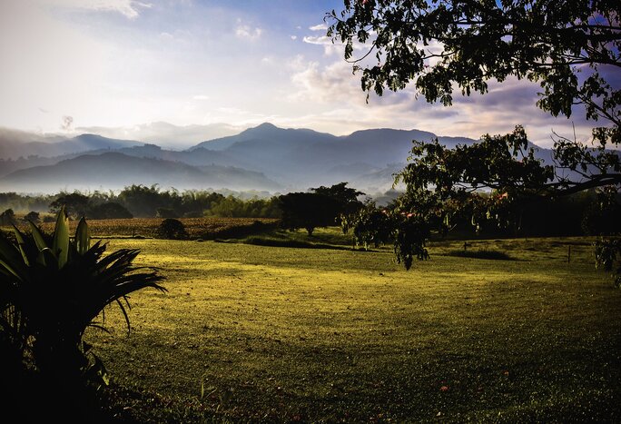 Dawn breaks over the Colombian Andes in Zona Cafetera, a region where coffee and cocoa grow in abundance