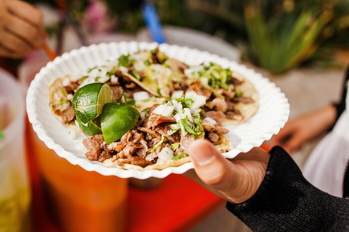 Learn how to order street food like tacos al pastor from a local guide