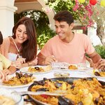 Learn to make the perfect paella with a family cooking class in Madrid