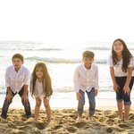 A group of children on the beach by the sea on the Peruvian coast