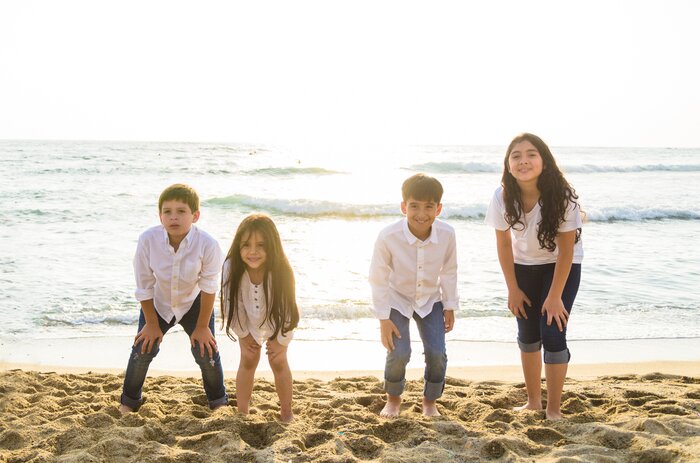 A group of children on the beach by the sea on the Peruvian coast