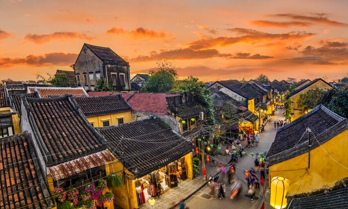Spend two evenings walking the streets of Hoi An's Ancient Town at dusk