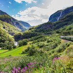 Take an epic journey through Norway's scenic fjords and mountains on the Flåm railway