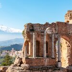 Taormina's Teatro Greco with a snowcapped Mount Etna