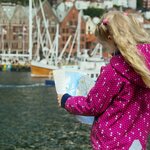 Journey through ancient Norse kingdoms on a walk with your family and guide through Bergen