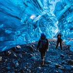 Wander through glacial ice caves on this 16-day Iceland adventure