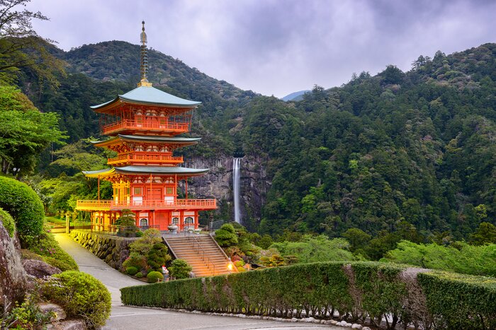 Follow an ancient stone path along the Kumano Kodo trail to see the Nachi Waterfall