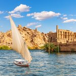Spot Aswan's landmarks aboard a felucca, a traditional wooden sailboat
