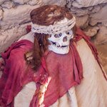 Preserved mummy in a tomb of Chauchilla cemetery in Nazca, Peru