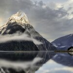 Cruise the glassy waters of Milford Sound / Piopiotahi, a fjord on New Zealand's South Island