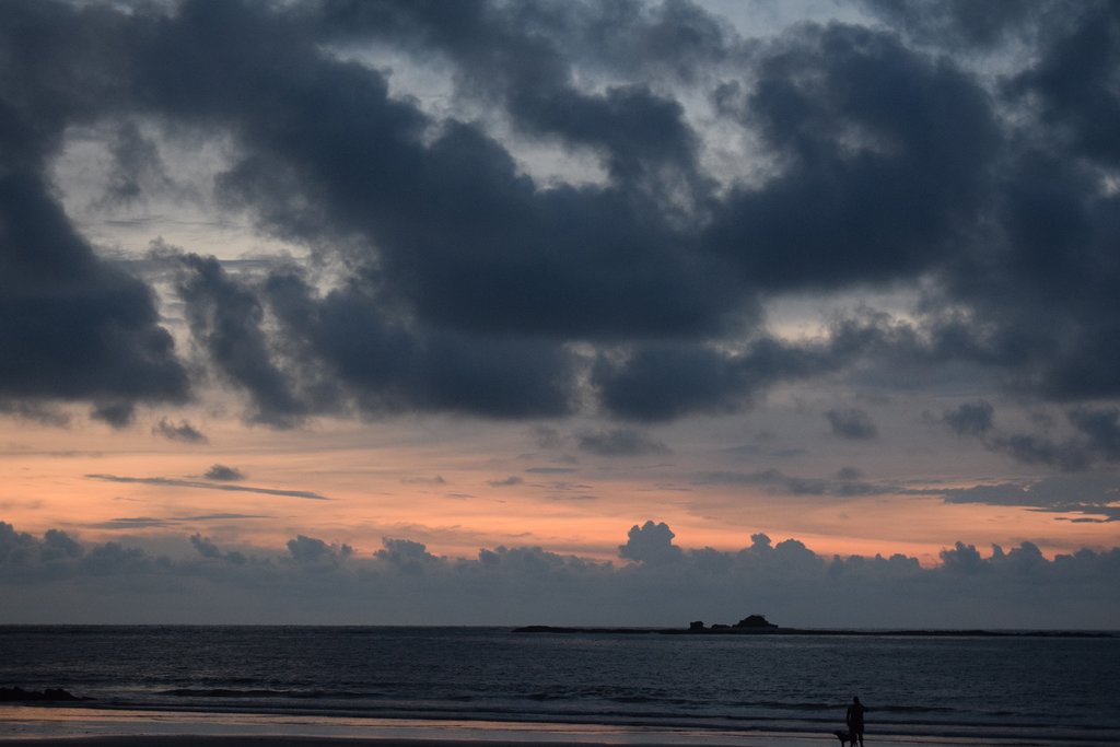 A dramatic sunset over the ocean at Playa Tamarindo