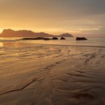 Travel to remote beaches in Malaysian Borneo, unobstructed by crowds and urban development