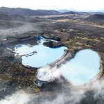 An aerial view of Earth Lagoon's milky blue geothermal waters (photo courtesy of Earth Lagoon Mývatn)