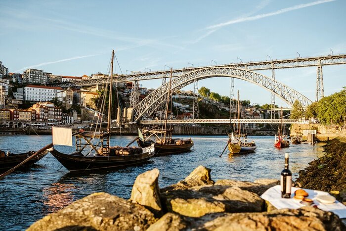 Sip port wine along the banks of Porto's Douro River
