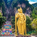 Climb the steps to enter the popular Batu Caves just outside Kuala Lumpur
