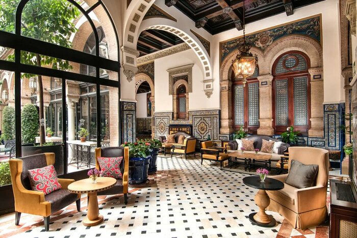 Enjoy time in the elegant Seville property (photo courtesy of Hotel Alfonso XIII)