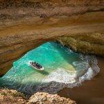 Enter the cathedral-like famous Benagil Cave by boat
