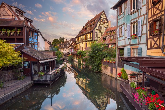 View of Canal and Half-Timbered Houses in Colmar, France