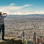 A man looks out over Bogotá from Cerro Monserrate
