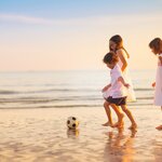 Watch the kids have a blast on Rio's white-sand beaches