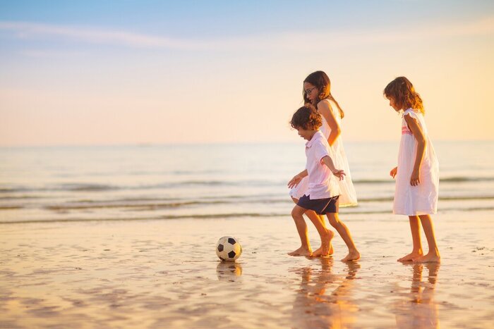Watch the kids have a blast on Rio's white-sand beaches