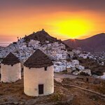 Explore the Cyclades and land on Ios to see its traditional houses, windmills, and churches