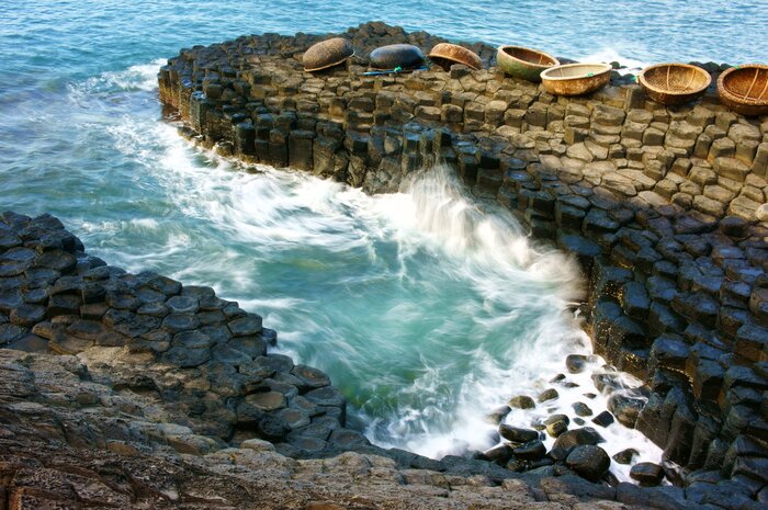 Snap pics of Da Dia Reef on a Phu Yen beach day of the basalt, honeycomb-shaped rock formations