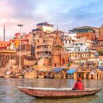A Hindu sadhu observing the city of Varanasi from the Ganges River