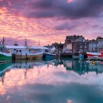 A colorful sunset over Padstow's harbor showcases why artists have always flocked to Cornwall